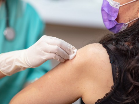 Woman receiving vaccine