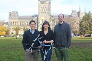 group of researchers with drone