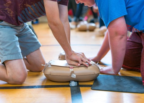 Students learning CPR