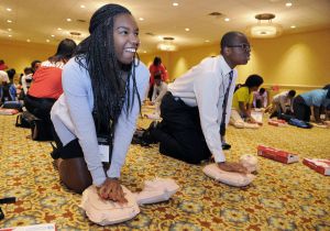 people learning CPR