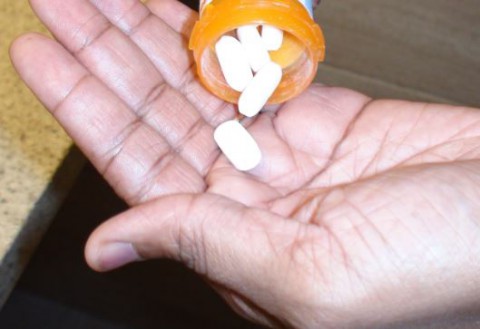 Opiod pouring into hand