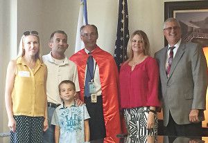 From left: Lana Kendall, Mark Kendall and their son Timothy, Investigator Dossett and his wife Rebekah, and State Attorney Ashton