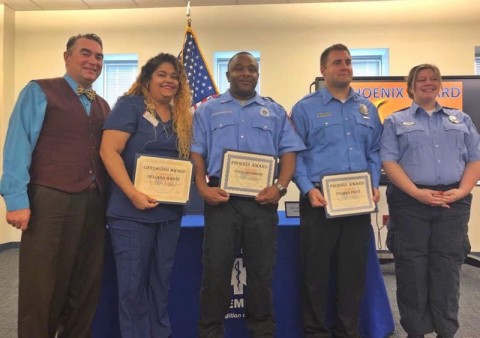 Wendall Thorne, left, and his rescuers