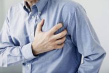 man clutching heart