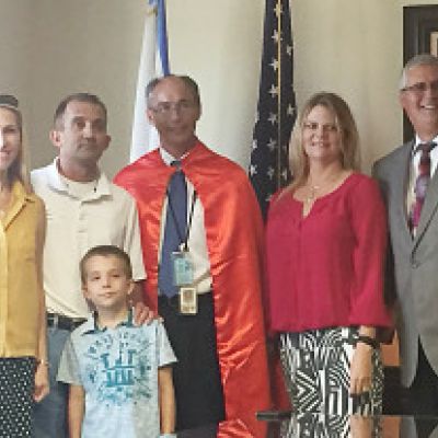 From left: Lana Kendall, Mark Kendall and their son Timothy, Investigator Dossett and his wife Rebekah, and State Attorney Ashton