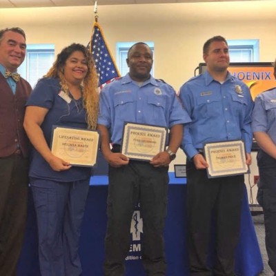 Wendall Thorne, left, and his rescuers