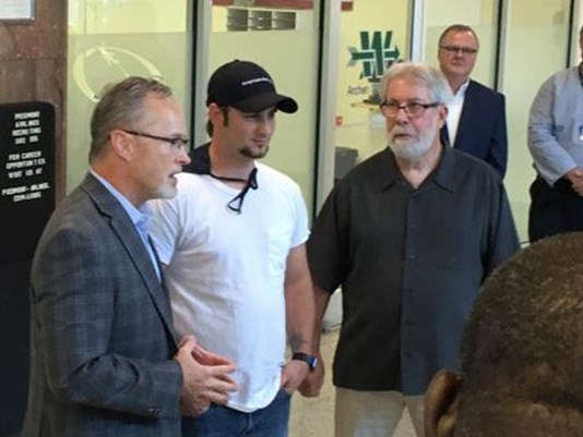 Christofer Hatcu, center, with Paul Gonnelli, right
